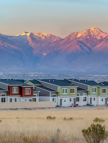 Homes in front of mountain range